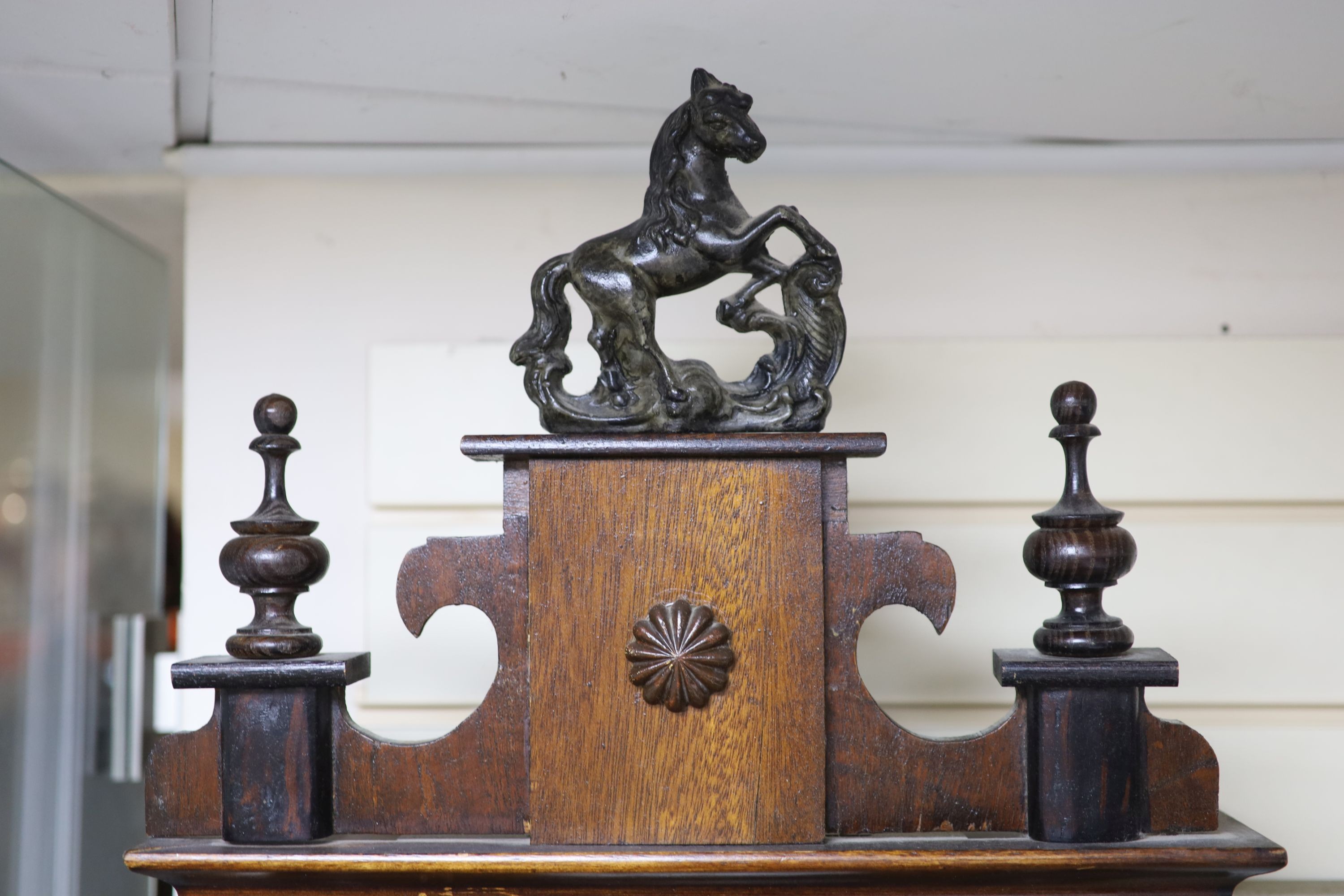 A 19th century Continental regulator in architectural walnut case, with key and gridiron pendulum, 116cm